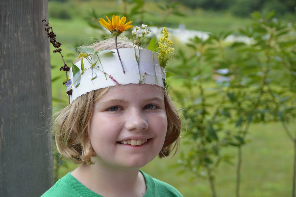 Rushton Nature Keeper wearing her nature headdress last summer.  Photo by Blake Goll/Staff